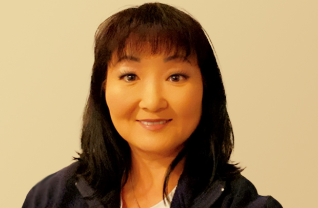 Selective Property Claims Specialist Laurie Ross smiling and wearing a dark fleece jacket.