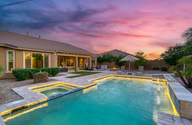 Backyard in-ground pool protected by Umbrella Insurance from Selective.